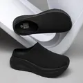 Men's minimalist black slip-on knit mule shoes featuring a thick cushioned platform sole - All Black
