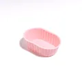 Small pink oval silicone cheesecake mold with ribbed texture for reusable baking cups - Pink