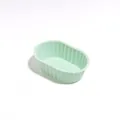 Small oval silicone cheesecake mold in mint green color for reusable dessert baking - Green