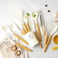 12-piece cream silicone kitchen utensil set with ergonomic yellow PP handles - White