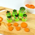 Stainless steel vegetable and fruit cutters set with green handles on wooden board - 6-Piece Set / Green