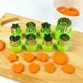 Stainless steel vegetable cutter set with green hand protectors on wooden board - 8-piece Set / Green