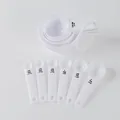 10-delige witte plastic maatbeker- en lepelset met gegraveerde capaciteitsmarkeringen bakken - 10-delige set / Set met witte Zirkonia