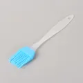 Small blue silicone basting brush with translucent plastic handle for BBQ and baking tools - Bulk/Loose Packaging / Blue