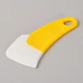 Durable yellow and white silicone scraper tool for kitchen cleaning and oil removal - Yellow