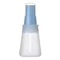 Light blue silicone oil bottle brush with clear measurement scale and protective cap - Nordic Blue