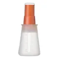 Orange silicone oil bottle with integrated brush and dust lid for BBQ and baking use - Orange