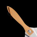 Detailed view of the ergonomic wooden handle of an aluminum pizza peel with leather strap - Wooden Handle Pizza Server