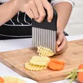 Manual stainless steel crinkle cutter for wavy potato and carrot slices on wooden board. - Crinkle Cutter (020606) / 14x9.5cm