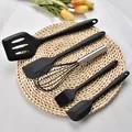 Black 5-piece silicone kitchen utensil set with stainless steel whisk on round mat. - Bracelets Group / Black