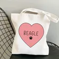 White canvas tote bag featuring a pink heart and Beagle print with dog paw detail - Pink Heart Beagle (STD1673-A)