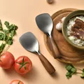 Standing pure titanium rice spoon featuring a natural acacia wood handle for home kitchens - Walnut Color