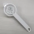 White long-handled plastic egg white separator and yolk filter tool for home baking use - Cream