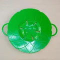 Heat-resistant green petal-shaped silicone spill stopper lid with dual side handles - Green
