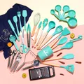 44-piece silicone kitchen utensil set with wooden handles in mint green on pink background - 44-Piece Set / Green