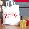 Weißer Canvas-Shopper mit rotem Merry Christmas-Aufdruck und festlichen Rentier-Motiven - Roter Frohe Weihnachten Schriftzug Aufdruck (C5) / 37x34cm Keine Innentasche Kein Reißverschluss / Weiß