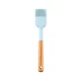 Light blue silicone basting brush with natural wood handle for baking and grilling. - Oil Brush