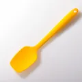 Durable bright yellow silicone baking spatula featuring a heat-resistant long handle - Large T-Shape Spatula