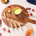 Close-up of six stainless steel fondue forks with oak wood handles and colored ends - Oak Handle Fondue Fork Set