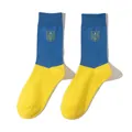 Detailed view of blue and yellow socks featuring the Ukrainian coat of arms trident - Men's Mid-Calf Socks Type 1