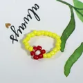 Handmade vibrant yellow seed bead ring featuring a charming red and white flower - Yellow with Red and White Flower (Style 7)