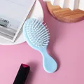 Mini portable air cushion massage hairbrush for children and women in light blue color - Fresh Green