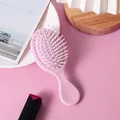 Portable mini pink air cushion hair brush for gentle scalp massage and travel hair care - Pink (Pink Cushion)