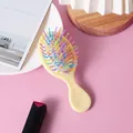 Portable mini cushion hairbrush with colorful wavy bristles and pale yellow handle - Yellow (Rainbow Pins)