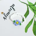 Bohemian handmade beaded ring featuring a blue flower design and white beads - White with Blue Flower (款式24)