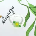 Handmade bohemian white seed bead ring featuring a vibrant green crystal flower charm - White with Light Green Flower (Style 35)