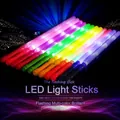 Vibrant multi-colored LED glow sticks lighting up a dark concert and party scene - Five-LED Reinforced Version / Multicolor Mix