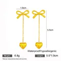Elegant gold-plated bow and heart tassel earrings with dimensions and weight info. - Gold Heart Butterfly Tassel Earrings