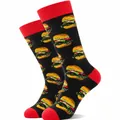 Detailed shot of black crew socks featuring a vibrant hamburger pattern and red trim - Burger Style / Black