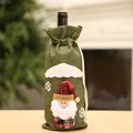 Close-up of a festive green burlap Christmas wine bottle cover with Santa Claus applique - Green Santa Claus Style
