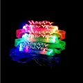 Stacked LED glowing shutter glasses with Happy New Year text on black background - 4-LED Happy New Year Glasses
