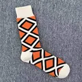Men's cotton mid-calf socks featuring a vibrant orange and black geometric diamond pattern - One Size / Orange Black Geometric