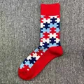 Men's cotton mid-calf socks featuring colorful puzzle piece pattern on red base - One Size / Red Puzzle Pattern