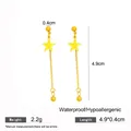 Gold-colored star tassel dangle earrings with 4.9x0.4cm dimensions and 2.2g weight. - Gold Polished Star Tassel Earrings