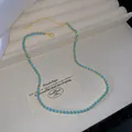 Elegant gold-tone alloy necklace with blue crystal stones, minimalist jewelry for women - Light Blue