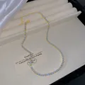 Elegant gold plated alloy necklace featuring minimalist light blue crystal stones for women - Sky Blue