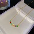 Élégant collier en or avec pierres arc-en-ciel et initiale O en cristal étincelante. - Style Lettre O