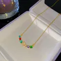 Élégant collier en or avec pierres arc-en-ciel et pendentif lettre R orné de strass brillants - Style Lettre R