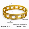 Gedetailleerde afmetingen en gewichtsspecificaties van de gouden klaver stalen armband - Holle Laser Klavertje Vier Armring / Goud