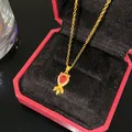 Collier poisson doré vintage avec pendentif en zircon rouge dans un écrin de luxe rouge - Poisson Rouge Vivant Pierre Rouge