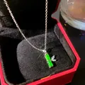 Close-up of a silver necklace with a green bamboo jade-style pendant in a gift box - Emerald Look Bamboo (W1181-2)