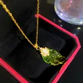 Macro detail of elegant green leaf pendant necklace with sparkling stone accents - Auspicious Cloud Green Leaf (W1190-1)
