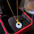 Close-up of a white imitation jade Ping An Kou pendant with a gold chain in a luxury red box - Cloud White Ping'an Buckle (W1201)