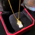 Detailed close-up of elegant Ruyi pendant necklace with white faux jade and gold chain - White Jade Ru Yi Style (W1212)
