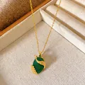 Close-up of a gold-plated necklace featuring a vintage green stone pendant with zircon. - Oval Cabochon Phoenix Style (W076)