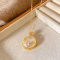 Detailed macro view of gold elk antler pendant necklace with cubic zirconia and flowers - Antler Floral Disc Style (W079)